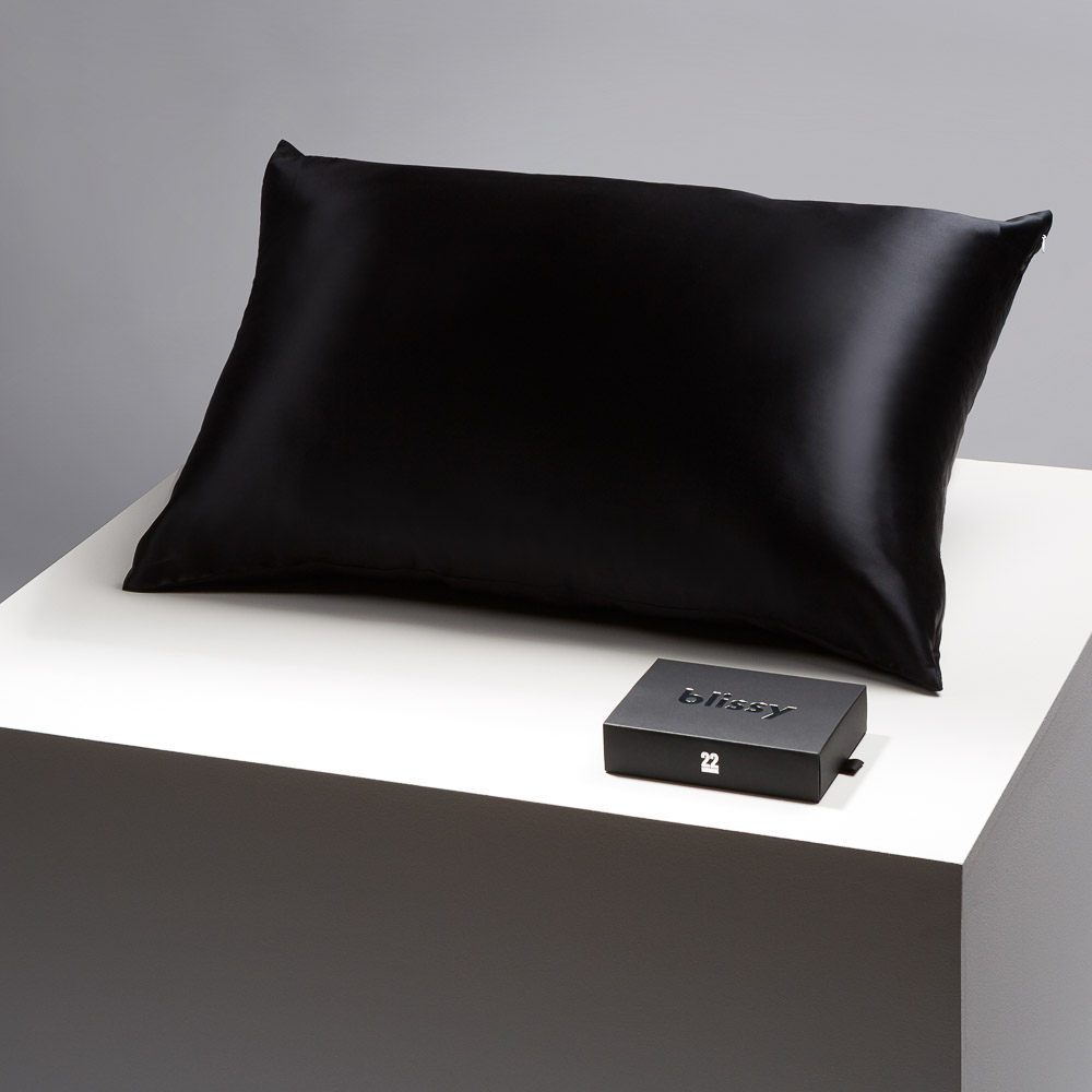 Blissy black pillowcase on a table