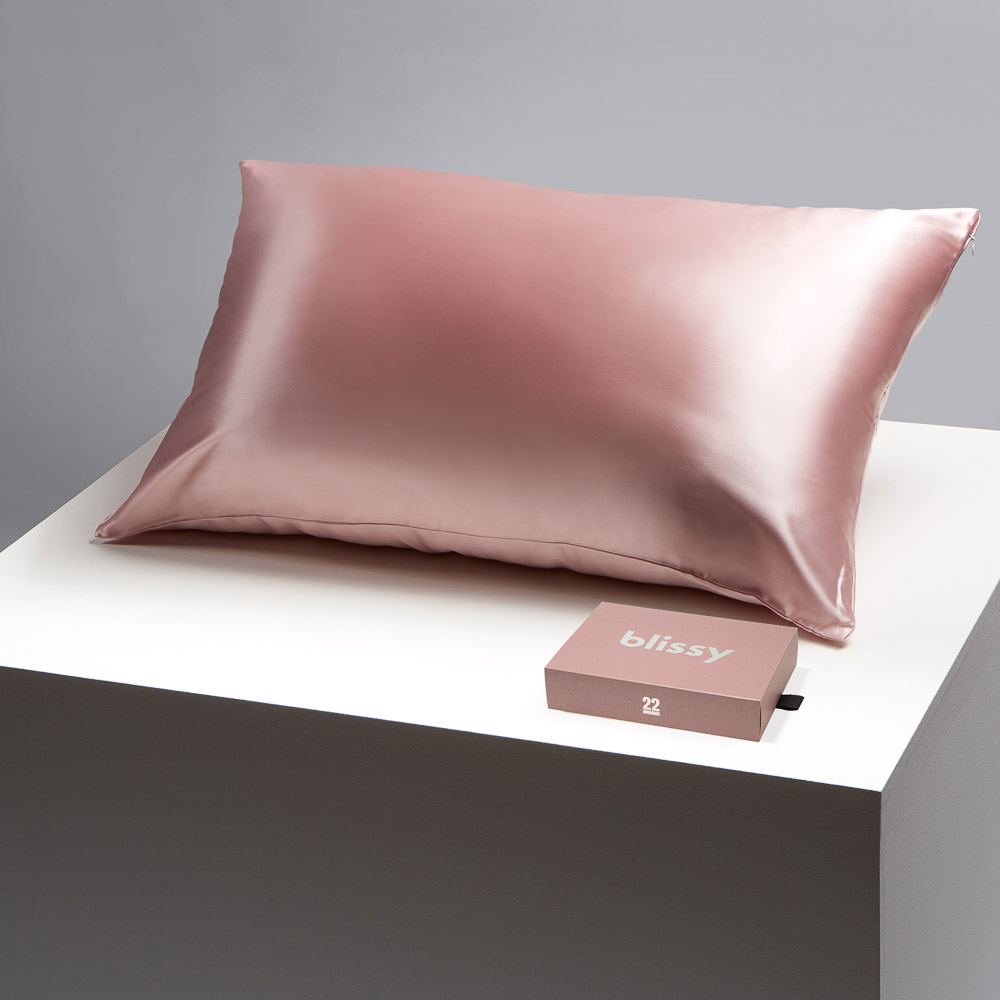 Blissy pink pillowcase on a table